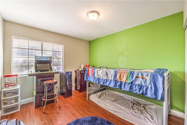 8932 Beach Front Dr, Las Vegas, NV 89117 - bedroom with baseboards and wood finished floors