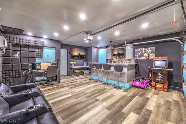 8932 Beach Front Dr, Las Vegas, NV 89117 - living room with recessed lighting, wood finished floors, and bar