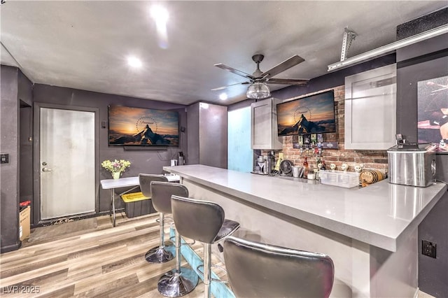 8932 Beach Front Dr, Las Vegas, NV 89117 - bar area with light wood-type flooring and a ceiling fan