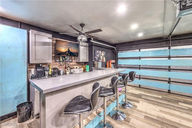8932 Beach Front Dr, Las Vegas, NV 89117 - indoor bar with light wood-type flooring, a ceiling fan, and recessed lighting