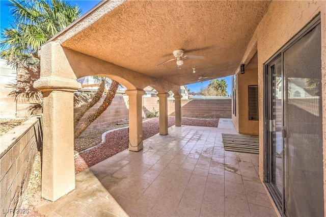 8932 Beach Front Dr, Las Vegas, NV 89117 - fenced backyard with a ceiling fan and a patio area