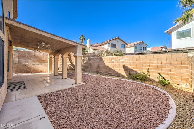 8932 Beach Front Dr, Las Vegas, NV 89117 - fenced backyard with a ceiling fan and a patio area