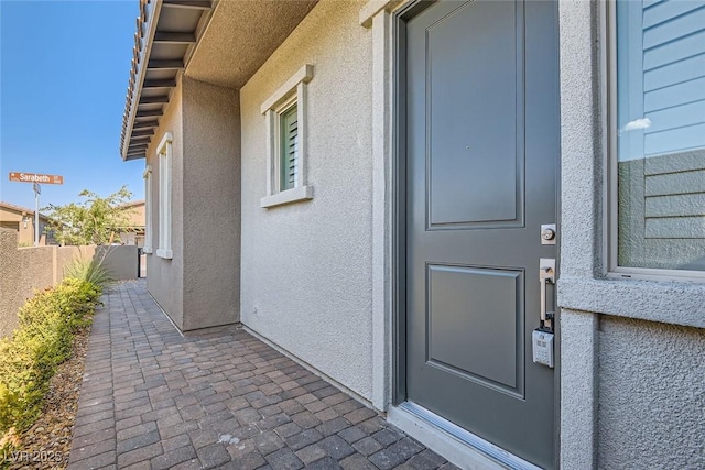 157 Sarabeth St, Las Vegas, NV 89138 - view of exterior entry with stucco siding and a patio
