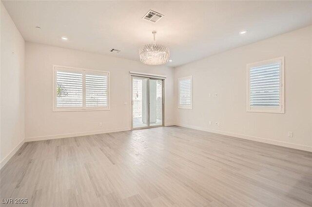 157 Sarabeth St, Las Vegas, NV 89138 - empty room with a chandelier, light wood-style floors, healthy amount of natural light, baseboards, and recessed lighting