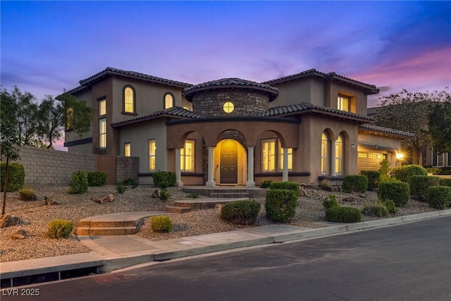 12021 La Palmera Ave, Las Vegas, NV 89138 - mediterranean / spanish-style house with a tiled roof, stucco siding, and covered porch