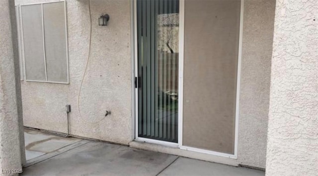 3644 Starlight Evening St, Las Vegas, NV 89129 - entrance to property featuring a patio and stucco siding