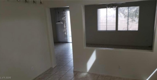 3644 Starlight Evening St, Las Vegas, NV 89129 - unfurnished room with light tile patterned floors and baseboards