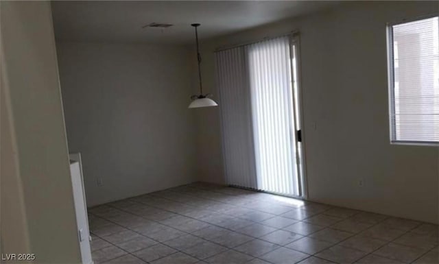 3644 Starlight Evening St, Las Vegas, NV 89129 - empty room featuring healthy amount of natural light and tile patterned floors