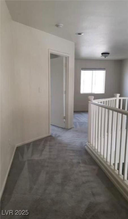 3644 Starlight Evening St, Las Vegas, NV 89129 - hall with carpet floors, baseboards, and an upstairs landing