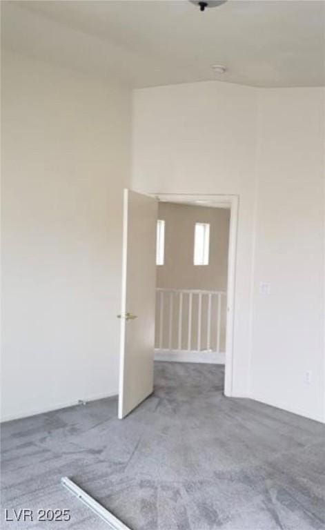 3644 Starlight Evening St, Las Vegas, NV 89129 - empty room with carpet flooring and vaulted ceiling