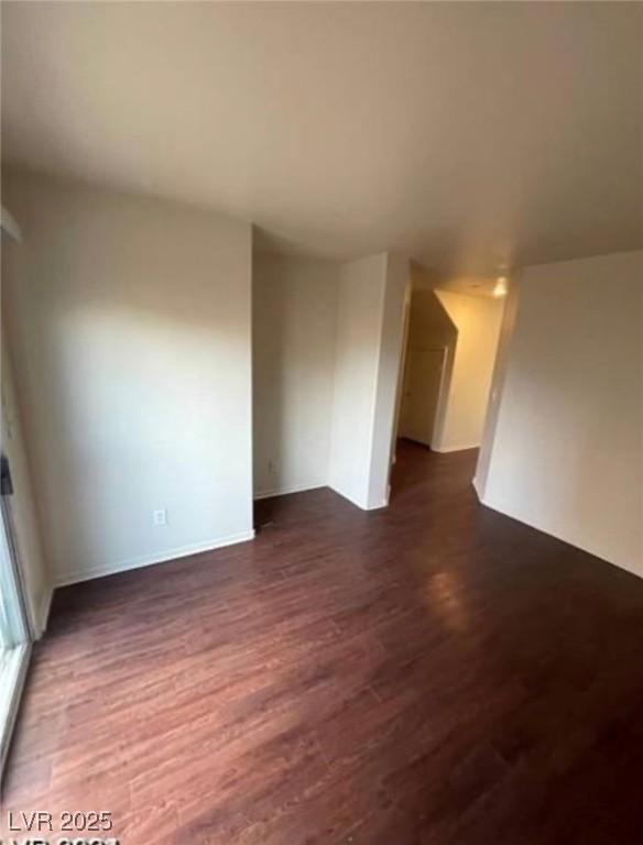 9402 Crimson Sky St, Las Vegas, NV 89178 - unfurnished room with dark wood-style floors and baseboards
