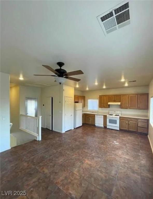 9402 Crimson Sky St, Las Vegas, NV 89178 - kitchen with white appliances, plenty of natural light, light countertops, and ceiling fan