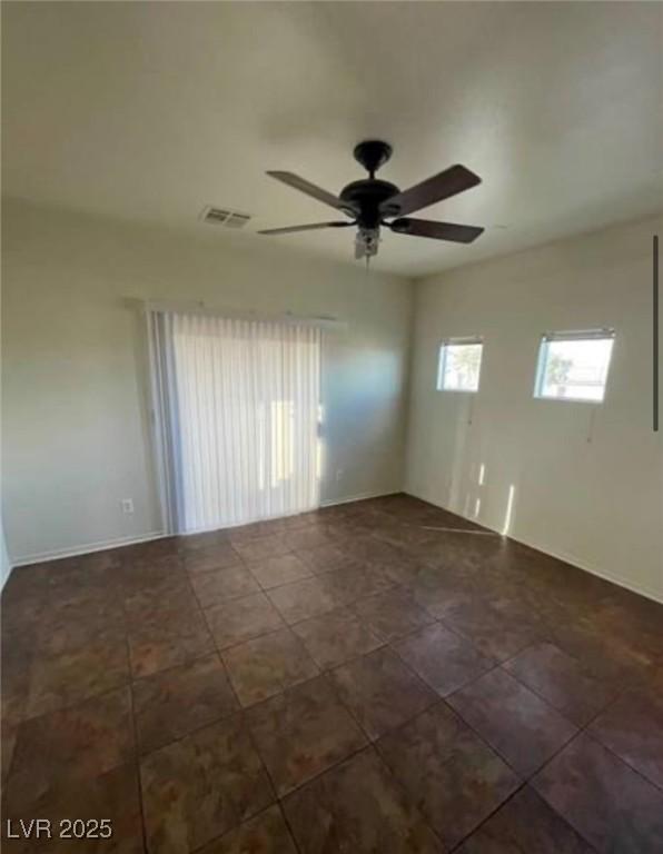 9402 Crimson Sky St, Las Vegas, NV 89178 - spare room featuring ceiling fan and baseboards