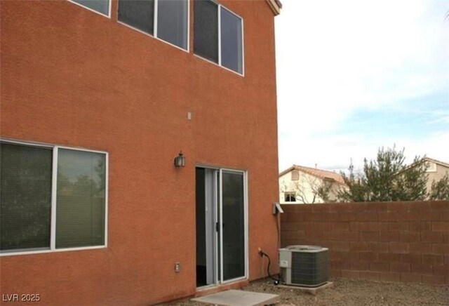 9402 Crimson Sky St, Las Vegas, NV 89178 - back of property featuring cooling unit and stucco siding