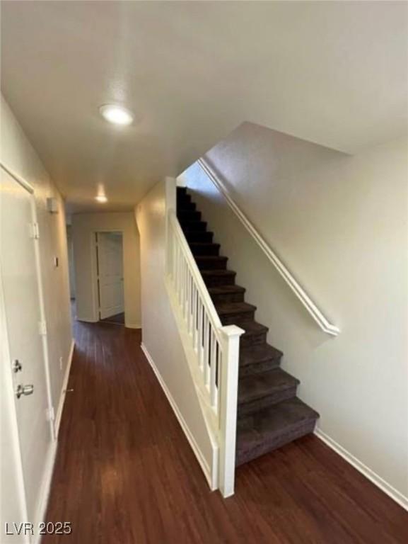 9402 Crimson Sky St, Las Vegas, NV 89178 - stairway with baseboards and wood finished floors