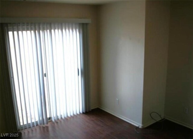 9402 Crimson Sky St, Las Vegas, NV 89178 - unfurnished room with baseboards and wood finished floors
