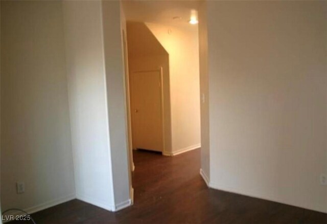 9402 Crimson Sky St, Las Vegas, NV 89178 - corridor featuring dark wood-style floors and baseboards