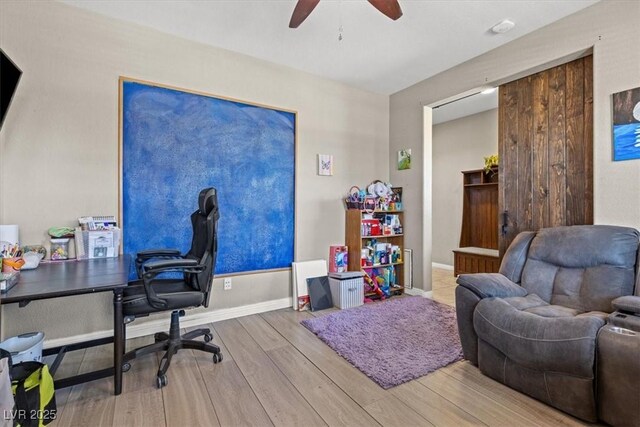 8925 Kenzie Cove St, Las Vegas, NV 89131 - home office featuring wood finished floors, ceiling fan, and baseboards