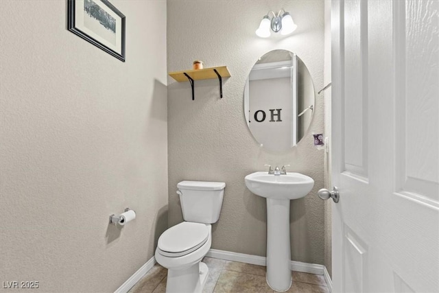 8925 Kenzie Cove St, Las Vegas, NV 89131 - bathroom featuring toilet, a sink, tile patterned floors, and baseboards