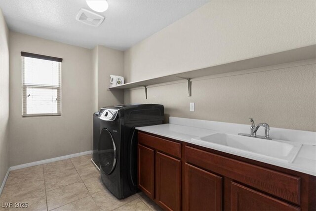 8925 Kenzie Cove St, Las Vegas, NV 89131 - washroom featuring baseboards, cabinet space, and light tile patterned floors