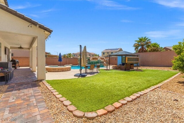 8925 Kenzie Cove St, Las Vegas, NV 89131 - view of yard featuring a gazebo, a ceiling fan, a pool with connected hot tub, and a patio