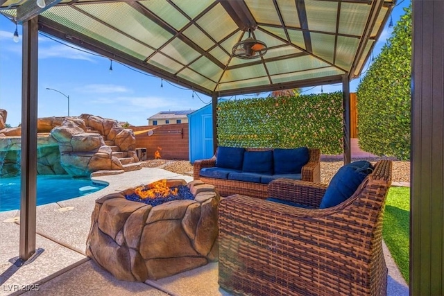 8925 Kenzie Cove St, Las Vegas, NV 89131 - view of patio / terrace featuring a gazebo and an outdoor living space with a fire pit