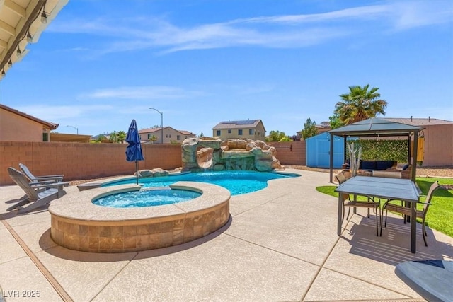 8925 Kenzie Cove St, Las Vegas, NV 89131 - view of pool with a gazebo, a patio area, a fenced backyard, a pool with connected hot tub, and outdoor dining space
