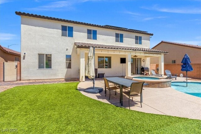 8925 Kenzie Cove St, Las Vegas, NV 89131 - rear view of property featuring a patio, stucco siding, and a pool with connected hot tub