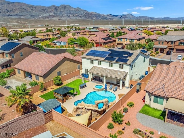 8925 Kenzie Cove St, Las Vegas, NV 89131 - aerial view of residential area with a mountain backdrop and a pool area