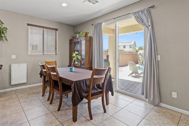 8925 Kenzie Cove St, Las Vegas, NV 89131 - dining room with healthy amount of natural light, baseboards, light tile patterned floors, and recessed lighting