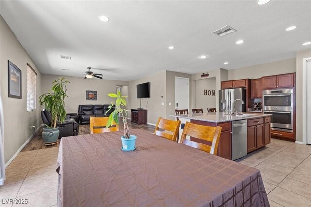 8925 Kenzie Cove St, Las Vegas, NV 89131 - dining room with light tile patterned floors, baseboards, ceiling fan, and recessed lighting