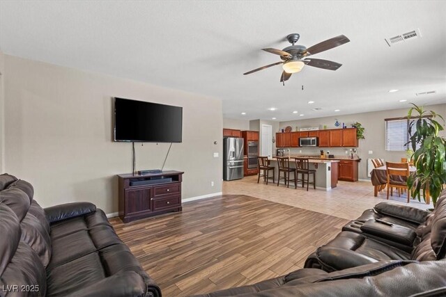 8925 Kenzie Cove St, Las Vegas, NV 89131 - living area featuring ceiling fan, recessed lighting, light wood finished floors, and baseboards