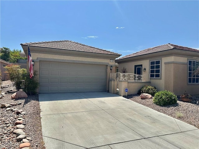 2138 Grand Traverse St, Henderson, NV 89052 - single story home with concrete driveway, a garage, stucco siding, and a tile roof