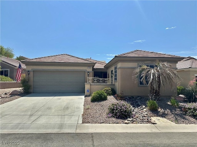 2138 Grand Traverse St, Henderson, NV 89052 - single story home with an attached garage, driveway, stucco siding, and a tiled roof