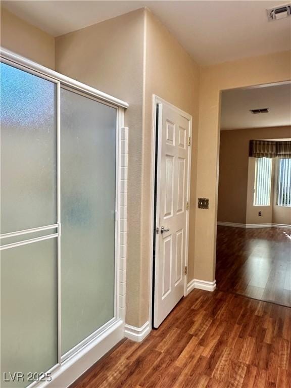 2138 Grand Traverse St, Henderson, NV 89052 - bathroom with wood finished floors, baseboards, and a stall shower