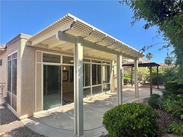 2138 Grand Traverse St, Henderson, NV 89052 - rear view of house with a pergola, a patio area, and stucco siding