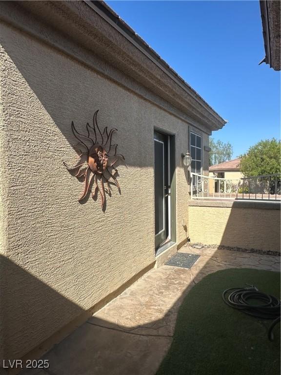 2138 Grand Traverse St, Henderson, NV 89052 - view of home's exterior with stucco siding