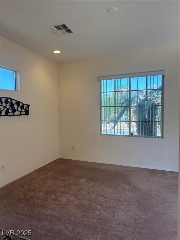 2138 Grand Traverse St, Henderson, NV 89052 - spare room with healthy amount of natural light, carpet flooring, and baseboards
