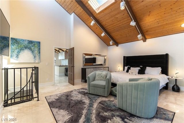 2845 Queens Courtyard Dr, Las Vegas, NV 89109 - bedroom with track lighting, wooden ceiling with exposed beams, a skylight, baseboards, and high vaulted ceiling