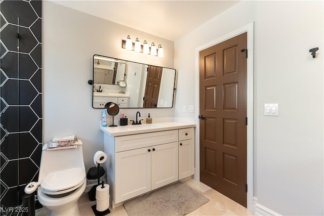 2845 Queens Courtyard Dr, Las Vegas, NV 89109 - bathroom featuring vanity, toilet, tiled shower, and baseboards