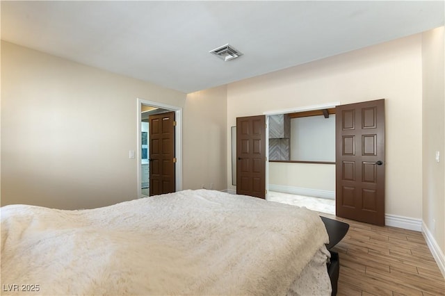 2845 Queens Courtyard Dr, Las Vegas, NV 89109 - bedroom featuring wood finished floors and baseboards