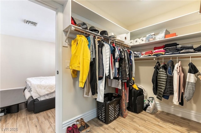 2845 Queens Courtyard Dr, Las Vegas, NV 89109 - spacious closet with wood finished floors