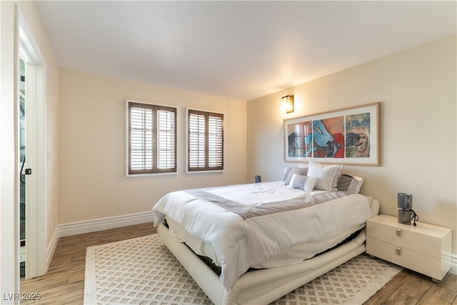 2845 Queens Courtyard Dr, Las Vegas, NV 89109 - bedroom featuring baseboards and light wood-style flooring