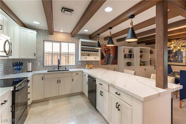2845 Queens Courtyard Dr, Las Vegas, NV 89109 - kitchen with stainless steel microwave, a sink, a peninsula, dishwashing machine, and backsplash