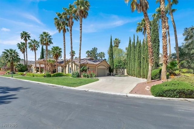 1813 Skyline Dr, Las Vegas, NV 89117 - view of front of house with an attached garage, concrete driveway, a front lawn, a tiled roof, and stucco siding