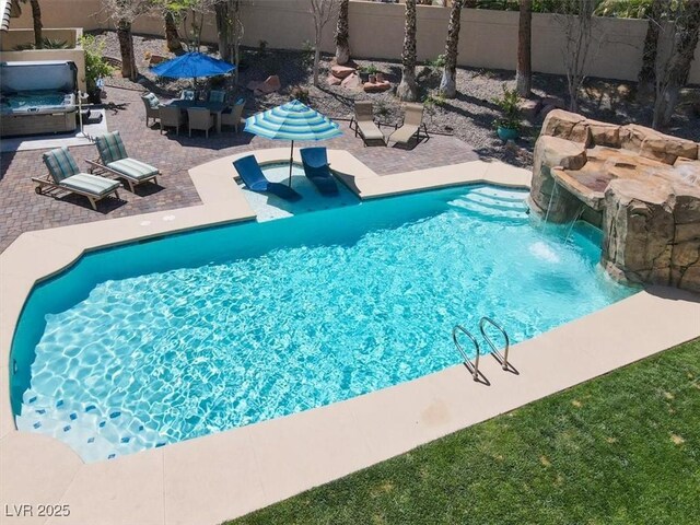 1813 Skyline Dr, Las Vegas, NV 89117 - view of swimming pool featuring a fenced backyard, a patio, and a hot tub