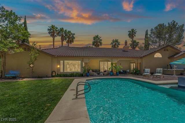1813 Skyline Dr, Las Vegas, NV 89117 - back of property featuring a patio, a tiled roof, an outdoor pool, and a yard