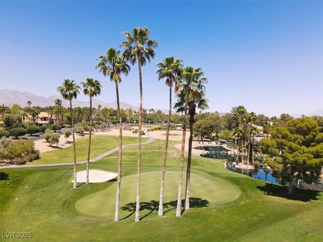 1813 Skyline Dr, Las Vegas, NV 89117 - view of home's community with golf course view, a water and mountain view, and a lawn