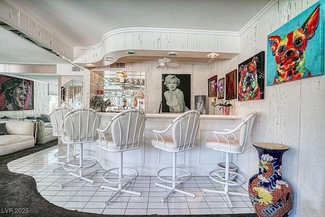 940 Vegas Valley Dr, Las Vegas, NV 89109 - indoor dry bar with a textured ceiling and crown molding