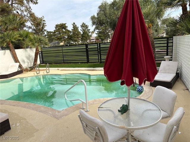 940 Vegas Valley Dr, Las Vegas, NV 89109 - view of swimming pool featuring a fenced backyard and outdoor dining area